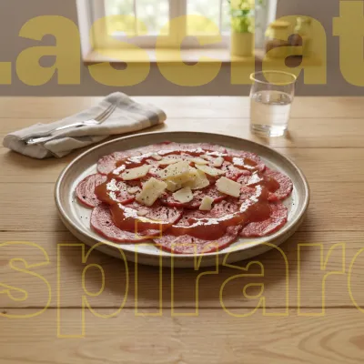 Carpaccio con salsa di Ramassin e scaglie di grana
