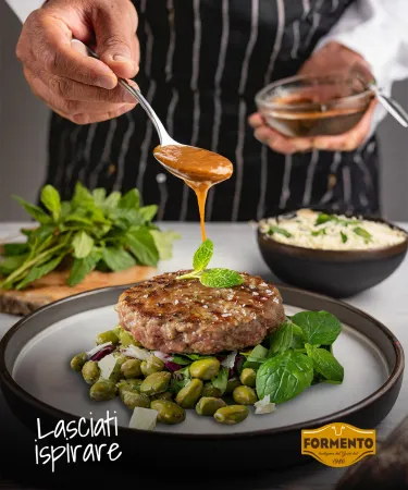 Medaglione alla griglia con insalatina di fave, pecorino e menta