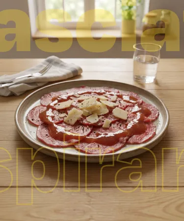 Carpaccio con salsa di Ramassin e scaglie di grana